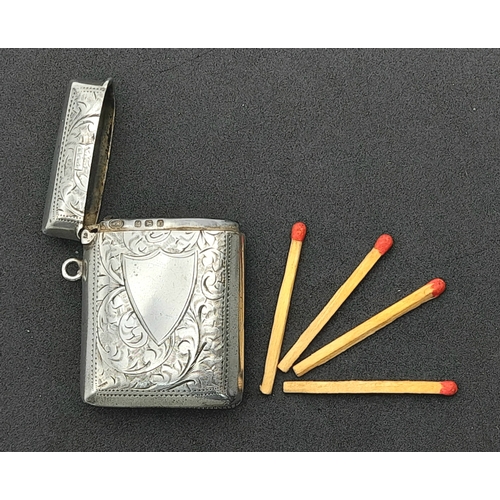 1187 - An antique sterling silver vesta case with floral motif engravings. Full Birmingham hallmarks, 1907.... 