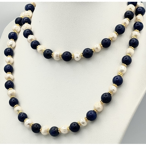 1314 - A Lapis Lazuli and Cultured Pearl Matinee Length Necklace. 72cm