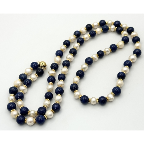 1314 - A Lapis Lazuli and Cultured Pearl Matinee Length Necklace. 72cm