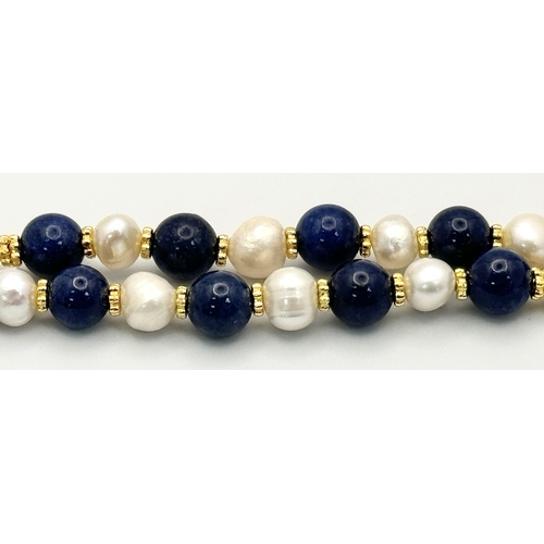 1314 - A Lapis Lazuli and Cultured Pearl Matinee Length Necklace. 72cm