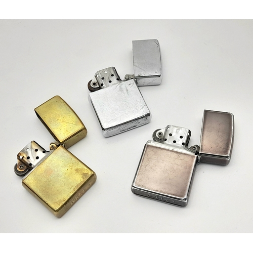 1190 - Three Vintage Zippo Lighters. One Brass and Two Silver Tone. One Engraved Malta 1942-92. One Early B... 