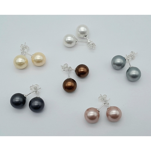 1300 - Six Pairs of South Sea Pearl Shell Stud Earrings.