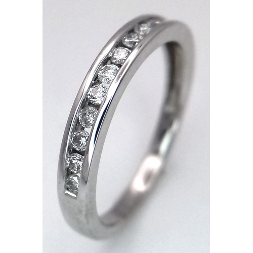 156 - AN 18K WHITE GOLD DIAMOND HALF ETERNITY RING - 0.28CTW.  2.5G. SIZE M. SC5083.