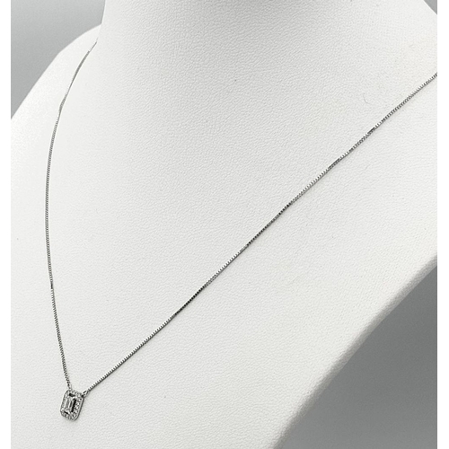 147 - An 18K Gold Emerald Cut Diamond Pendant on an 18K White Gold Disappearing Necklace. 7mm pendant. 44c... 