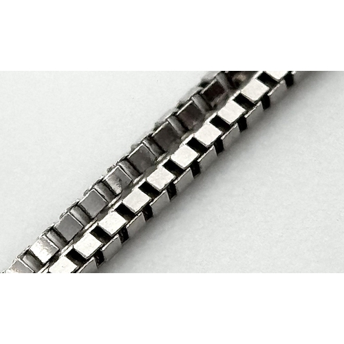 147 - An 18K Gold Emerald Cut Diamond Pendant on an 18K White Gold Disappearing Necklace. 7mm pendant. 44c... 