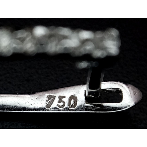 21 - A pair of Art Deco Style Pair of 18K White Gold and Diamond Drop Earrings. A multitude of diamond en... 
