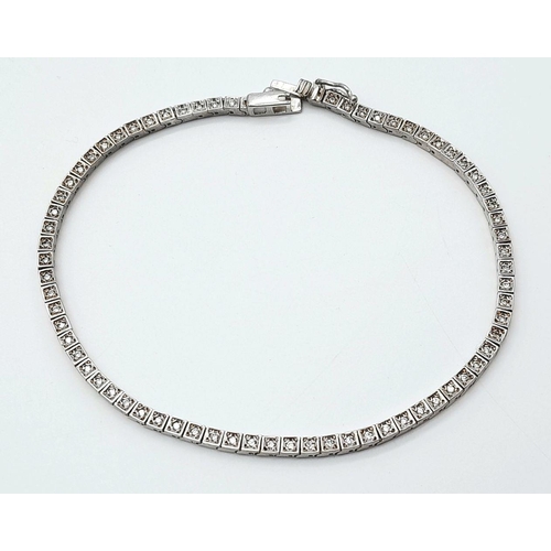 196 - A 14K White Gold Tennis Bracelet. 19cm. 8.6g total weight.