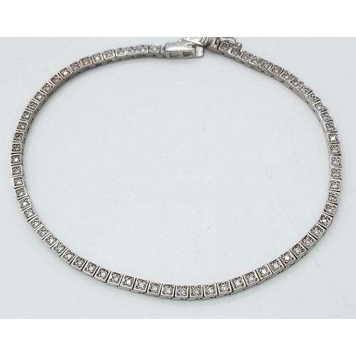 196 - A 14K White Gold Tennis Bracelet. 19cm. 8.6g total weight.