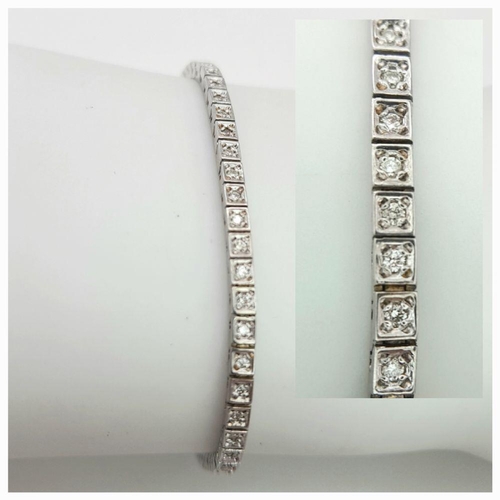 196 - A 14K White Gold Tennis Bracelet. 19cm. 8.6g total weight.