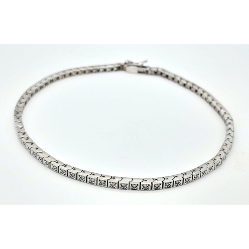 196 - A 14K White Gold Tennis Bracelet. 19cm. 8.6g total weight.