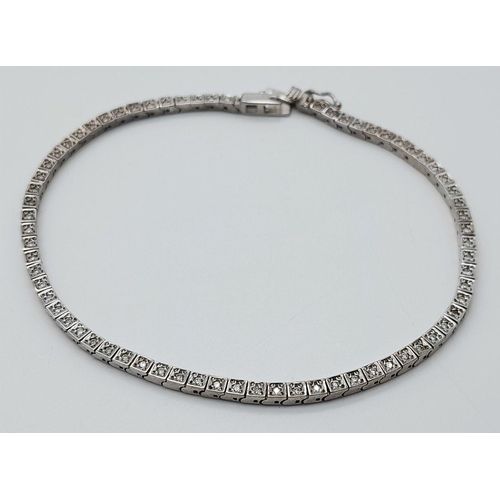 196 - A 14K White Gold Tennis Bracelet. 19cm. 8.6g total weight.