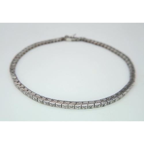 196 - A 14K White Gold Tennis Bracelet. 19cm. 8.6g total weight.