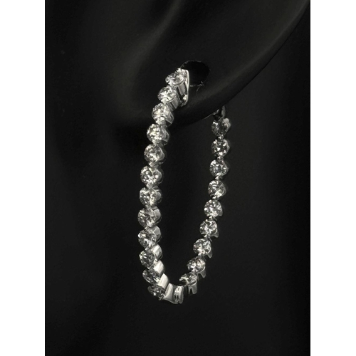 119 - A Pair of 18K White Gold and Diamond Oval Hoop Earrings. 48 diamonds in total - 2ctw approx. 6.3g to... 