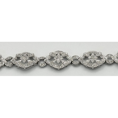 189 - An Art Deco Style 14K White Gold and Diamond Bracelet. 18cm. 10.9g. Five small stones missing so A/F... 