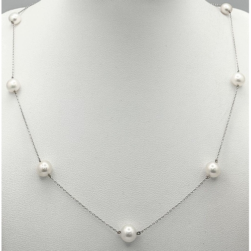 343 - An 18K White Gold Necklace with Nine Pearl Decoration. 7.4g total weight. Pearls, 7/8mm. 44cm length... 
