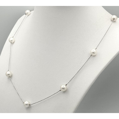 343 - An 18K White Gold Necklace with Nine Pearl Decoration. 7.4g total weight. Pearls, 7/8mm. 44cm length... 