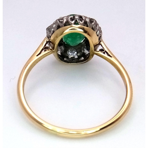 357 - An 18K Yellow Gold, Emerald and Diamond Ring. A 1.3ct oval cut central emerald with a 1ctw brilliant... 