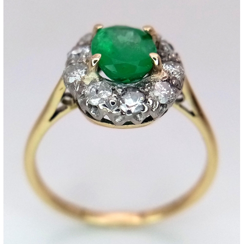 357 - An 18K Yellow Gold, Emerald and Diamond Ring. A 1.3ct oval cut central emerald with a 1ctw brilliant... 