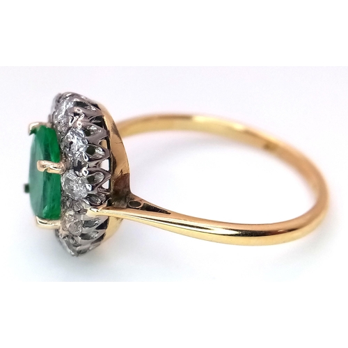 357 - An 18K Yellow Gold, Emerald and Diamond Ring. A 1.3ct oval cut central emerald with a 1ctw brilliant... 
