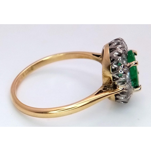 357 - An 18K Yellow Gold, Emerald and Diamond Ring. A 1.3ct oval cut central emerald with a 1ctw brilliant... 
