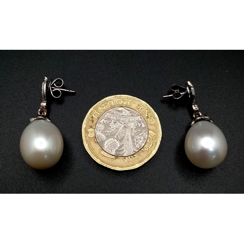 431 - A Pair of Vintage 18K White Gold, Diamond and Pearl Earrings. Large 15mm oval pearls. 8.1g total wei... 