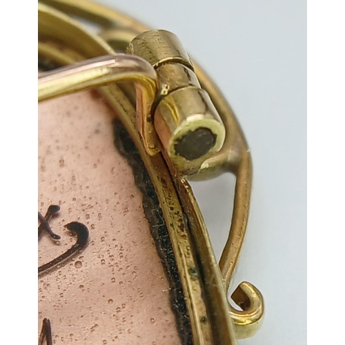 342 - An 18K Yellow Gold Limoges Portrait Brooch. Trillion form. 4cm. 6.3g