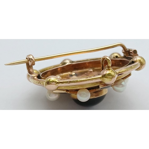 438 - An Antique 18K Gold, Pearl and Garnet Circular Brooch. Central blood red garnet cabochon with a pear... 