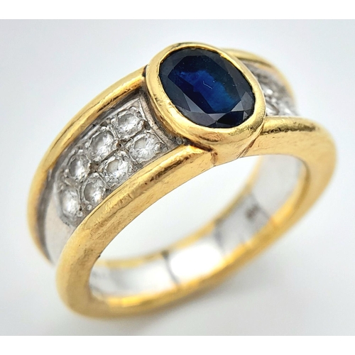 203 - AN 18K YELLOW AND WHITE GOLD BAND RING WITH DIAMOND SHOULDERS AND ONYX CENTRE STONE .  11.2gms    si... 