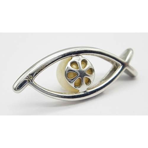382 - A 9K White Gold, Pearl, and diamond Eye of Horus Pendant. 2.4g total weight.
