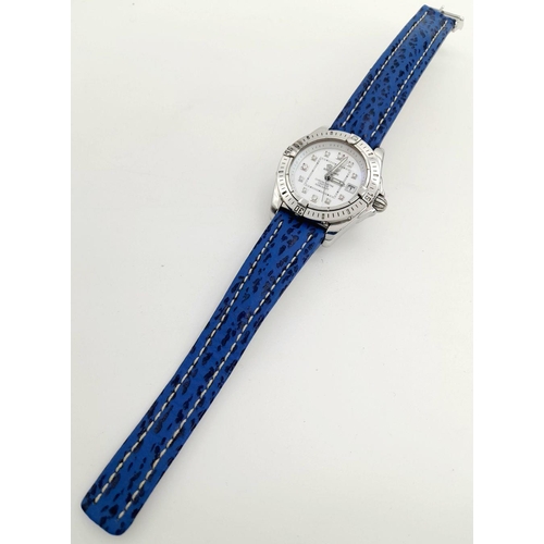 105 - A Breitling (A 71356) Ladies Quartz Watch. Blue leather strap. Stainless steel case - 32mm. Mother o... 