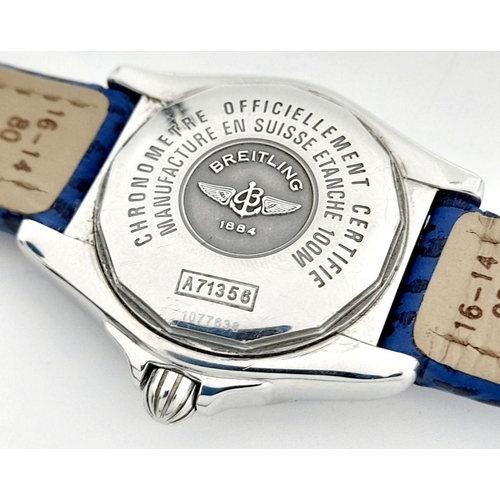 105 - A Breitling (A 71356) Ladies Quartz Watch. Blue leather strap. Stainless steel case - 32mm. Mother o... 