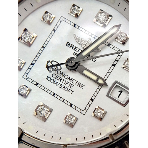 105 - A Breitling (A 71356) Ladies Quartz Watch. Blue leather strap. Stainless steel case - 32mm. Mother o... 