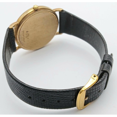 182 - A 9K Gold Cased Longine Quartz Gents Watch. Black leather strap. 9K gold case - 34mm. White dial wit... 
