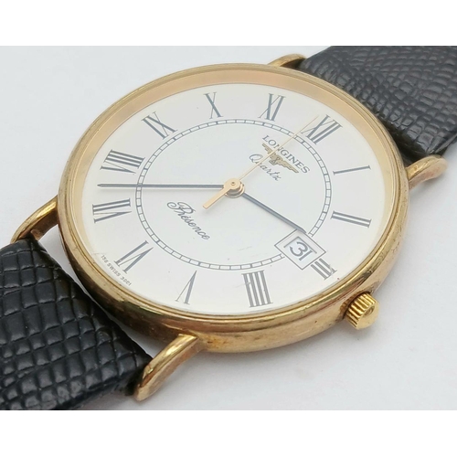 182 - A 9K Gold Cased Longine Quartz Gents Watch. Black leather strap. 9K gold case - 34mm. White dial wit... 