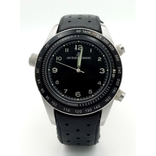 396 - A Jacques Lemans Dualtime Chronograph Gents Watch. Silver tone face with three sub dials and a class... 