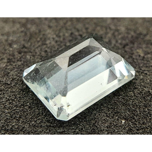 720 - A 1.71ct NATURAL AQUAMARINE IN EMERALD SHAPE , COMES WITH INDEPENDANT LABORATORY REPORT .