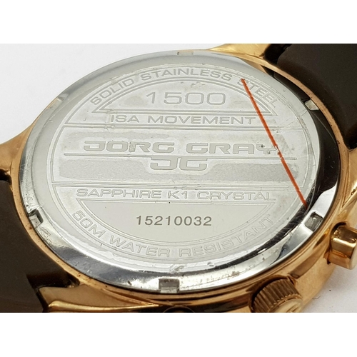 706 - A JORG GRAY CHRONOGRAPH IN ROSE GOLD COLOUR WITH 3 SUBDIALS AND BROWN RUBBER STRAP, NEW AND UNWORN .... 