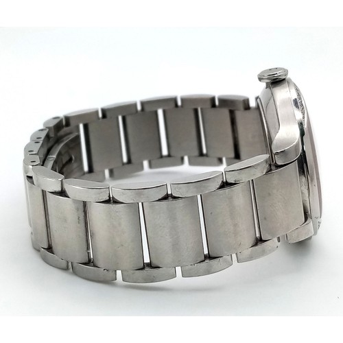 413 - A Baume and Mercier Diamond Quartz Ladies Watch. Stainless steel bracelet and case - 30mm. Diamond b... 