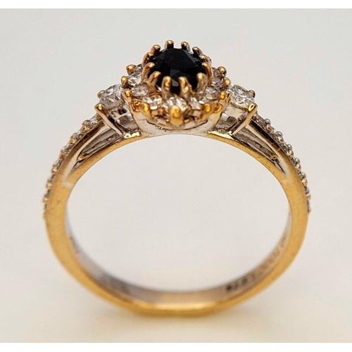 446 - An 18K Gold Sapphire and White Stone Ring. Size N. 3.3g