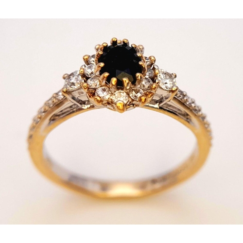 446 - An 18K Gold Sapphire and White Stone Ring. Size N. 3.3g