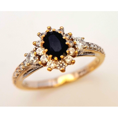 446 - An 18K Gold Sapphire and White Stone Ring. Size N. 3.3g