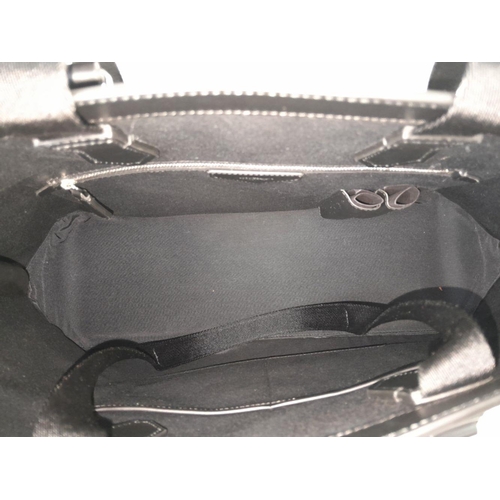692 - A Montblanc Black 4810 Tote Bag. Textured leather exterior with silver-toned hardware, two rolled le... 