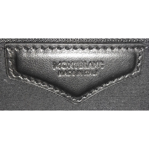 692 - A Montblanc Black 4810 Tote Bag. Textured leather exterior with silver-toned hardware, two rolled le... 
