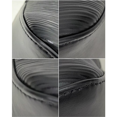 692 - A Montblanc Black 4810 Tote Bag. Textured leather exterior with silver-toned hardware, two rolled le... 