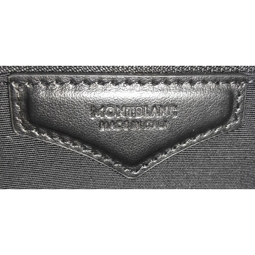 692 - A Montblanc Black 4810 Tote Bag. Textured leather exterior with silver-toned hardware, two rolled le... 