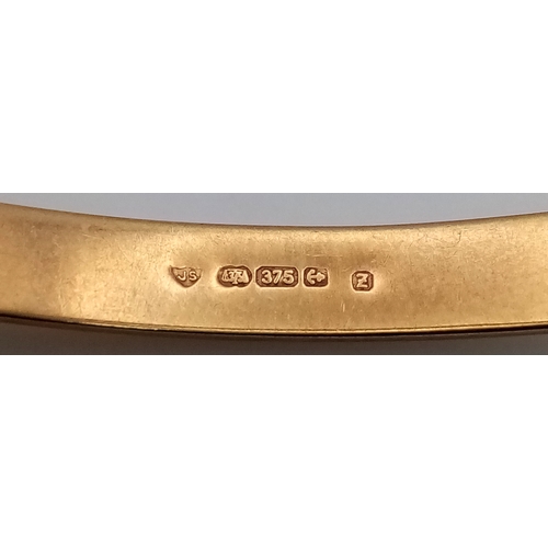 244 - A Vintage 9K Yellow Gold Bangle. Clip design and safety chain. 6.7g.