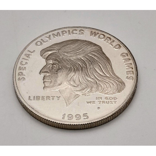 755 - A 1995 Special Olympics One Dollar Silver Coin. 26.8g