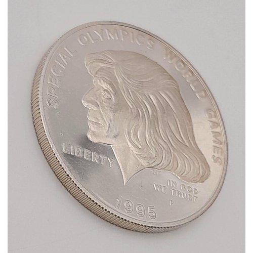 755 - A 1995 Special Olympics One Dollar Silver Coin. 26.8g