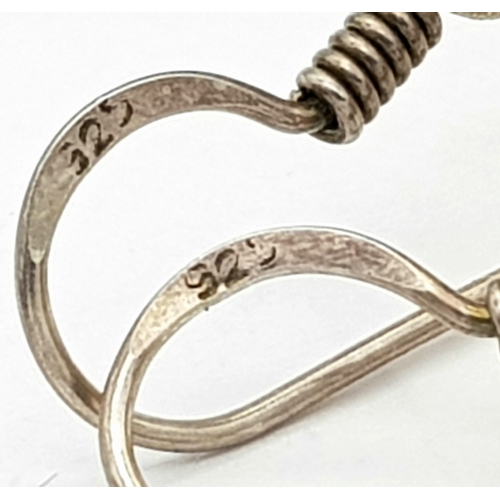 835 - A Pair of Natural Amber Hoop Earrings. 17g