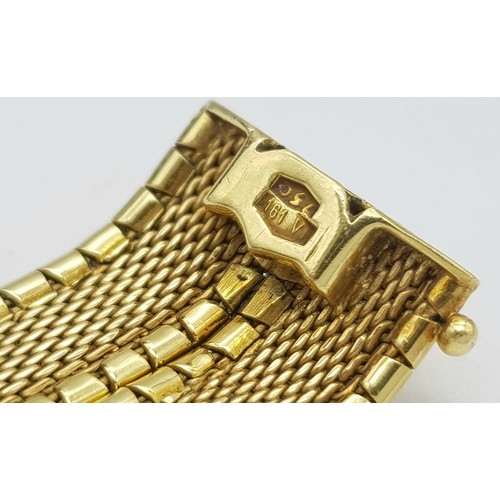 5 - A Tier One, Attractive, 18K Yellow Gold Two Row Bangle. Twin geometric pattern paved design with a c... 